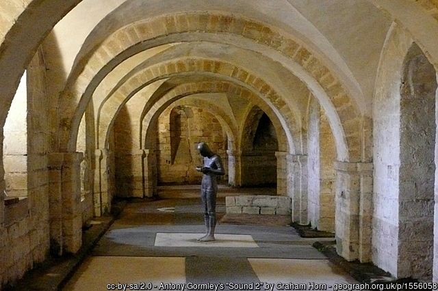 The crypt of Winchester Cathedral showing Gormley's statue Sound II 